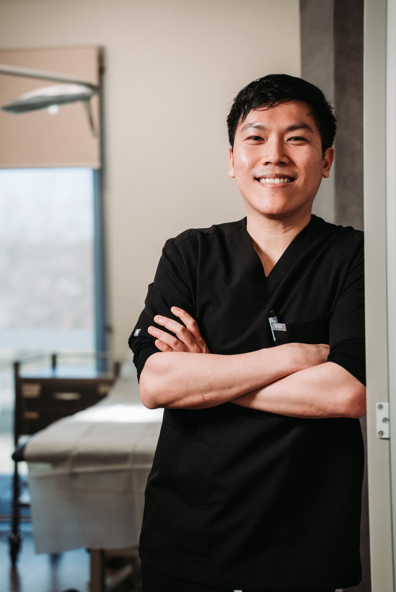 Dr William Fong standing in a consulting room