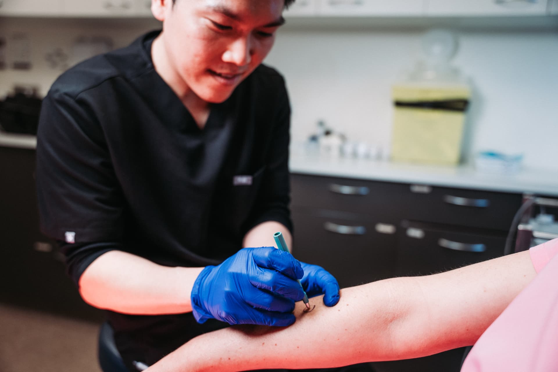 Dr William Fong performing a minor in-clinic procedure